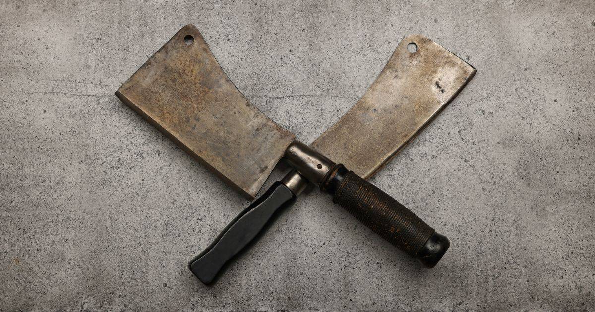 Crossing Butcher Cleavers made from Carbon Steel showing their patina